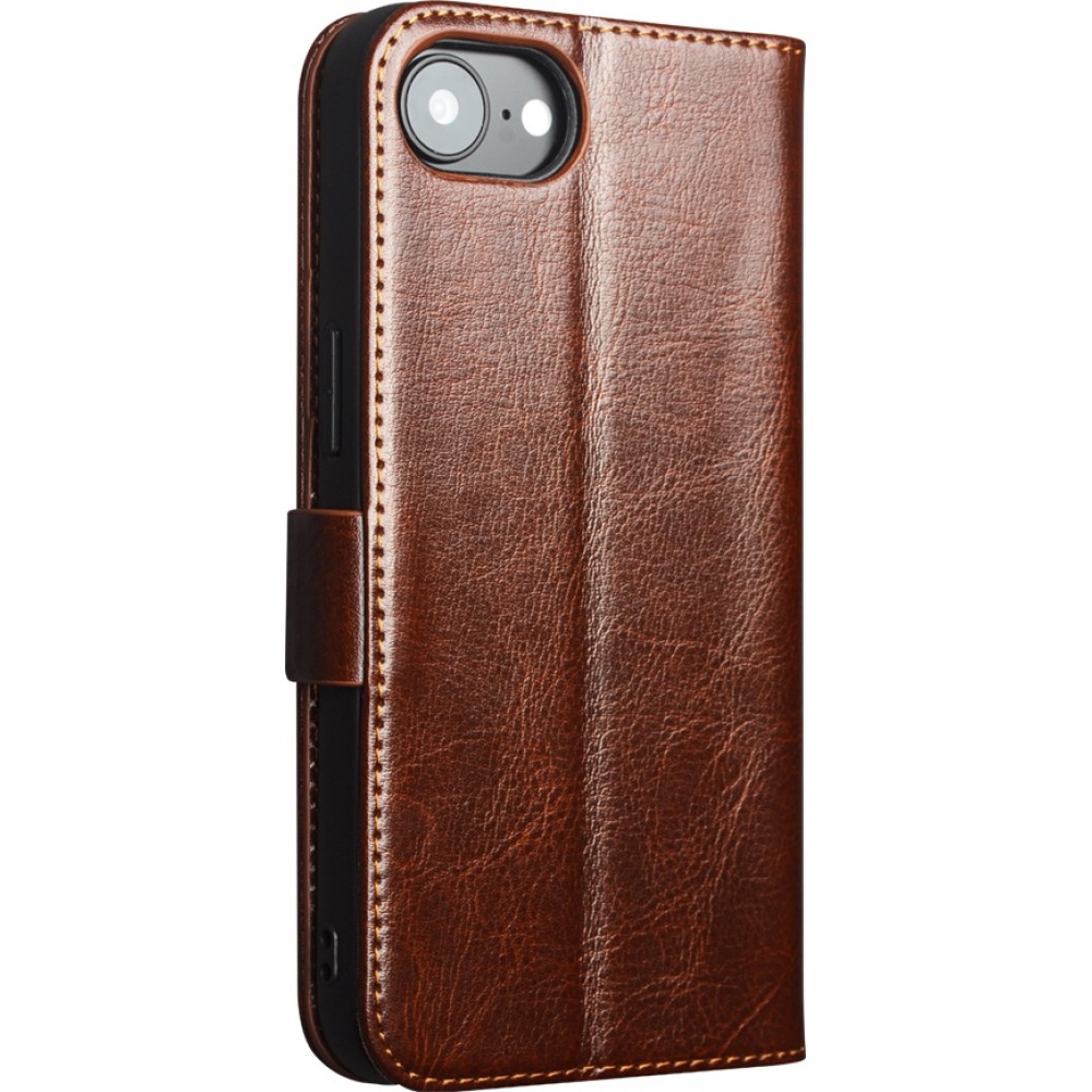 Fourre iPhone 16e - Flip Qialino cuir véritable avec fermeture magnétique - Brun
