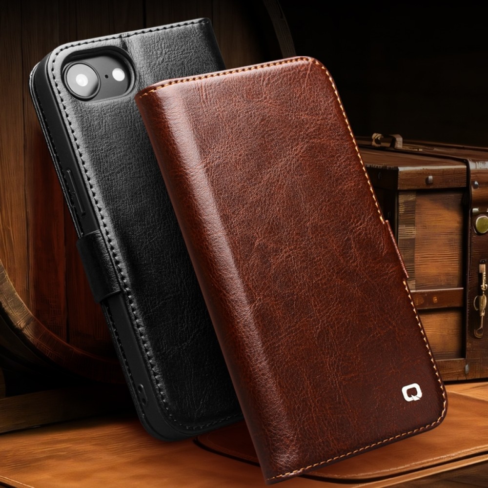 Fourre iPhone 16e - Flip Qialino cuir véritable avec fermeture magnétique - Noir