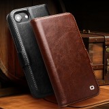 Fourre iPhone 16e - Flip Qialino cuir véritable avec fermeture magnétique - Noir