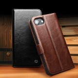 Fourre iPhone 16e - Flip Qialino cuir véritable avec fermeture magnétique - Noir
