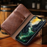 Fourre iPhone 16e - Flip Qialino cuir véritable avec fermeture magnétique - Noir